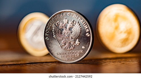 The Russian rouble coin between Dollar and Euro 