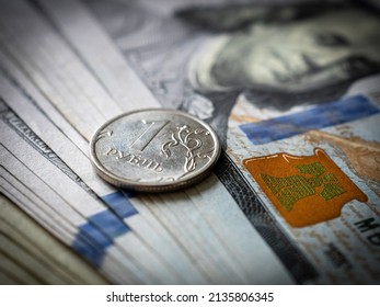 Russian rouble coin on a hundred dollar bill. Russia and USA money. Ruble and dollars. Currency exchange. Economic crisis. War in Ukraine effect. Financial analytics. Investment and banking. Business 