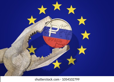 Russian Ruble Coin Being Squeezed In Vice On The European Union (EU) Flag Background. Concept New Sanctions Russia