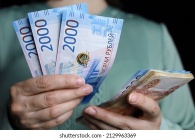 Russian Rubles In Female Hands, Cash Pay, Salary, Inflation Or Savings Concept. Woman Counting Paper Currency Of Russia