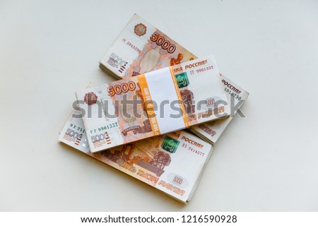 Russian rubles isolated on white background, packed stack of banknotes 5000 rubles