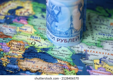 Russian rubles on map of Ukraine and Russia. Concept of russian support of Donbass - Shutterstock ID 2128406570