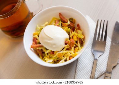 Russian salad Piquant - smoked sausage, green peas, cucumbers, corn and sour cream - Shutterstock ID 2188359785