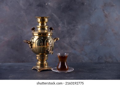 Russian samovar and a cup of tea. selective focus. blur background.