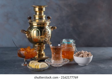 Russian samovar and tea in a pear-shaped glass. selective focus