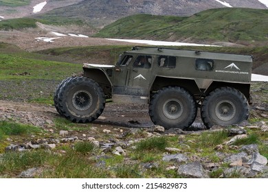 Russian snow swamp off road and all terrain vehicle Predator for transporting tourists and travelers in most difficult, harsh conditions driving on mountain road. Kamchatka, Russia - August 16, 2019