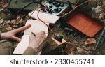 Russian Soviet Infantry Red Army Soldier In World War II using Russian Soviet Portable Radio Transceiver In Trench Entrenchment In Spring Autumn Forest. . Headphones And Telegraph Key. Close Up Hands,