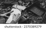 Russian Soviet Infantry Red Army Soldier In World War II using Russian Soviet Portable Radio Transceiver In Trench Entrenchment In Spring Autumn Forest. . Headphones And Telegraph Key. Close Up Hands,