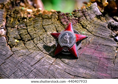 Russian soviet military award for the Winter War or Second World War "Red Star". Motto in the center says: "Proletarians of all countries, unite!"

