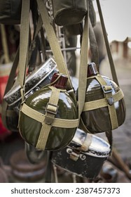 Russian Soviet Red Army Soldier's Military Equipment Of World War II. Flasks And Holster Hanging. A soldier's water flask. Soldier's uniform. An army soldier's water canister.