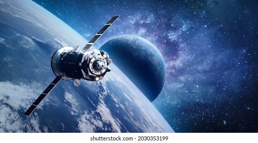 Russian spaceship on orbit of planet Earth. View from ISS station. Blue planets in deep space. Sci-fi wallpaper. Elements of this image furnished by NASA
