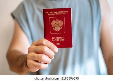 Russian tourist passport in the hand of a citizen. Immigration, legalization, travel concept. - Shutterstock ID 2193396395