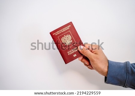 Russian tourist passport in the hand of a citizen. Immigration, legalization, travel concept. ストックフォト © 