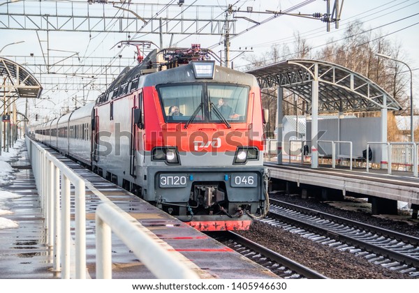 Russian train. Locomotive with cars.\
Passenger train. . Russia Metallostroy March 8,\
2019