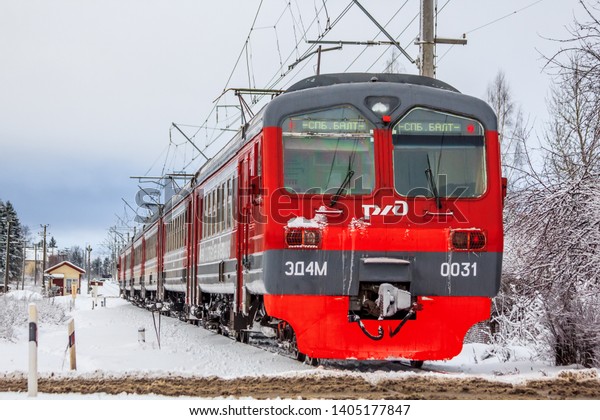 Russian train in the winter. The train on the\
platform. The train pulls up to the platform. Winter train. .\
Russia, Gatchina December 26,\
2018