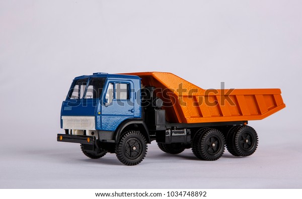 Russian truck.\
Miniature model on a white background. Cargo transportation. Space\
for text, empty space.\
Mockup