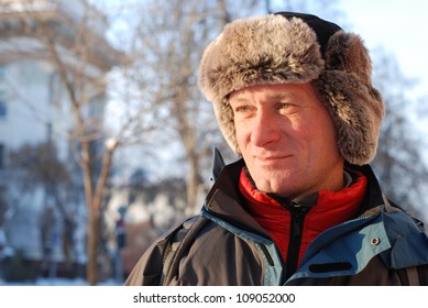 Russian Winter. A Smiling Man In A Fur Hat