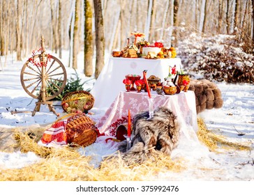 Russian Winter Wedding Decor With A Spinning Wheel, A Samovar And Pancakes