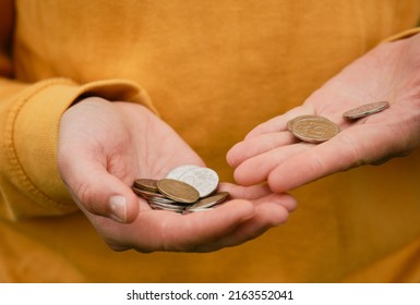 Russian Woman Considers Savings Cash. Only Mans Hands And Money, Yellow Clothes. Concept Of Poor Human. Russian Coins Hold In Hands And Count. Crisis And Economic Downturn.