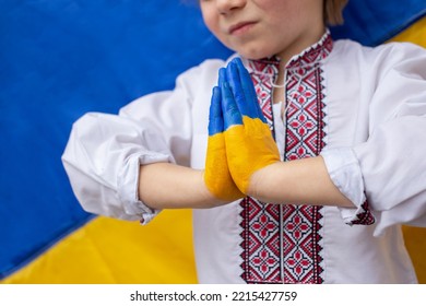 Russia's Military Invasion Of Ukraine, An Appeal To The World Community For Help To Ukrainians. Children Against War. Gesture Of Faith And Hope. Children's Hands Are Painted In Yellow And Blue