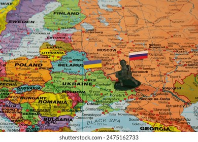 Russia-Ukraine Conflict Map with Soldier Figurine and Flags Highlighting Geographic Tensions. - Powered by Shutterstock