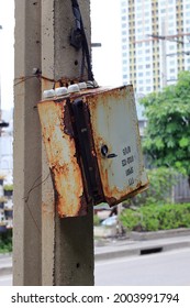 Rust And Broken Electrical Cable Box Cabinet On Power Line Pole.