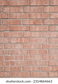rust colored brick wall with pale morter