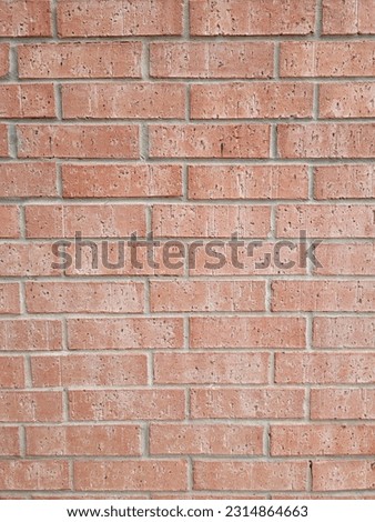 rust colored brick wall with pale morter