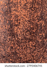 Rust covers the surface in deep orange-brown tones. Speckles spread unevenly across the textured background. Patina reveals age and exposure to elements. Ideal for backgrounds, industrial design