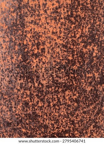 Rust covers the surface in deep orange-brown tones. Speckles spread unevenly across the textured background. Patina reveals age and exposure to elements. Ideal for backgrounds, industrial design