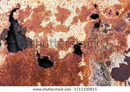 Rust forming on the metal hood car surface. Uniform corrosion on the hood car surface.