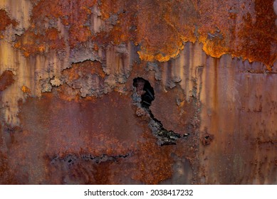 Rust metals Corrosive Rust old iron and hole  Rusted orange painted metal wall  Rusty metal background and streaks rust  Old shabby paint metal rust texture background