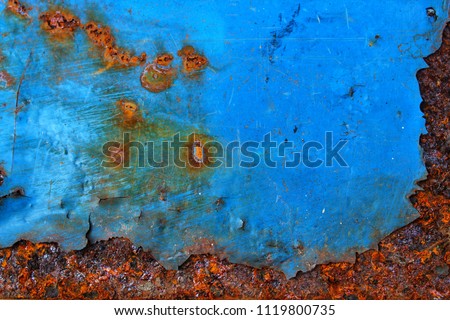 The rust on the steel plate is painted in blue.
