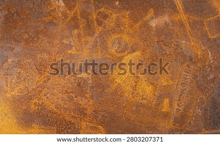 The rust pattern is a naturally occurring formation resulting from metal scraps left on a metal table and getting wet from rainwater