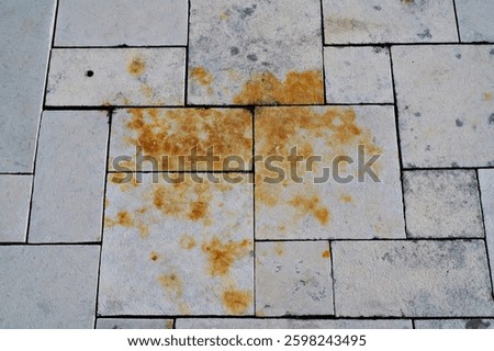 Rust stain on stone tile floor
