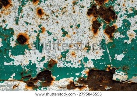 Rust texture on green scrap metal. Rust grains on a metal background. A rust effect with a layer of dirt used for vintage image styles for illustrations or presentations.