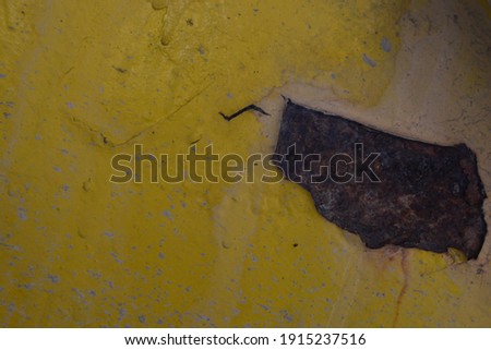 A rust and yellow bacground , roung yellow material texture 