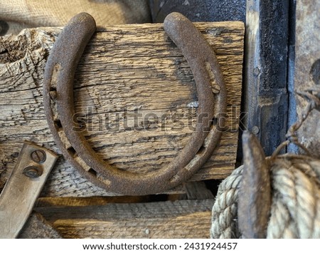 Rusted Antique Lucky Horseshoe Attached to Vintage Wood Wagon