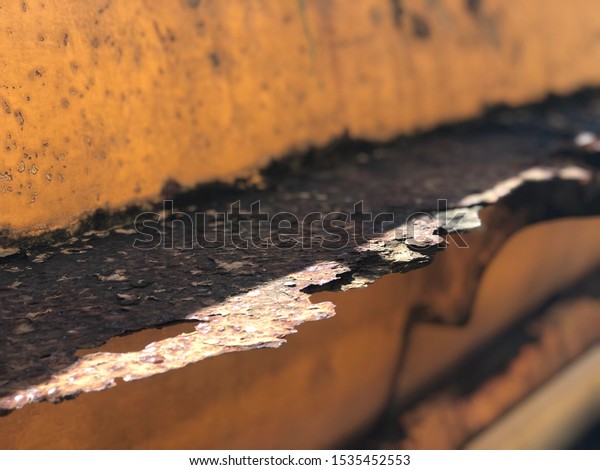 Rusted brown steel from old\
cars