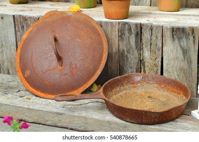 Rusted Cast Iron Pan On Rust Background, Selective Focus