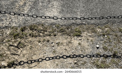Rusted chains casting shadows on desolate gravel, invoking Ghost Festivals eerie solitude and vintage industrial whispers