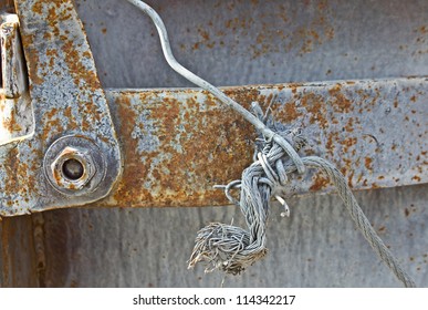 Rusted Grunge Metal Strap Handle Background With Frayed Wire.