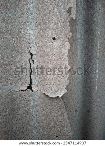 The rusted iron background represents a combination of a strong, natural material that degrades with time and environmental elements, providing deep character, interesting texture and meaningful visua