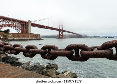 Rusted Iron Chain with the Golden gate bridge in backgroud - Powered by Shutterstock