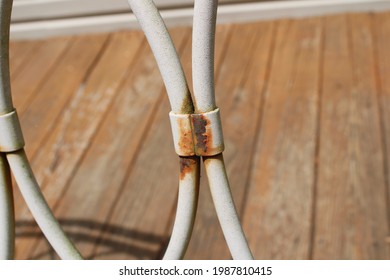 A Rusted Joint On A Metal Deck Chair