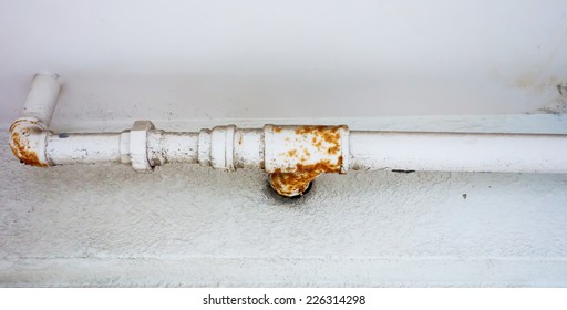rusted and leaking household water pipe 