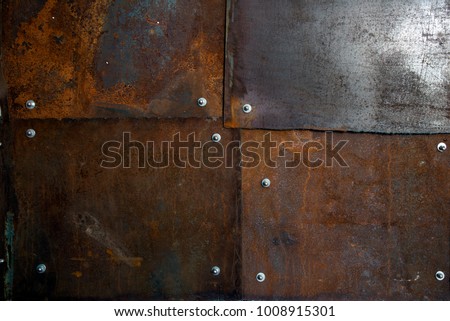 
Rusted metal sheets with bolts