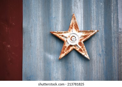 Rusted Metal Star On Building