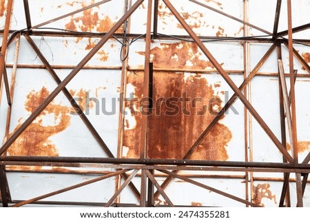 A rusted metal structure with a lot of rust on it. The structure appears to be old and worn down, with a lot of damage and decay. The rust gives the structure a sense of age and history