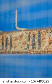 Rusted Numbers On The Hangers Of The Abandoned Swimming Pool Changing Room